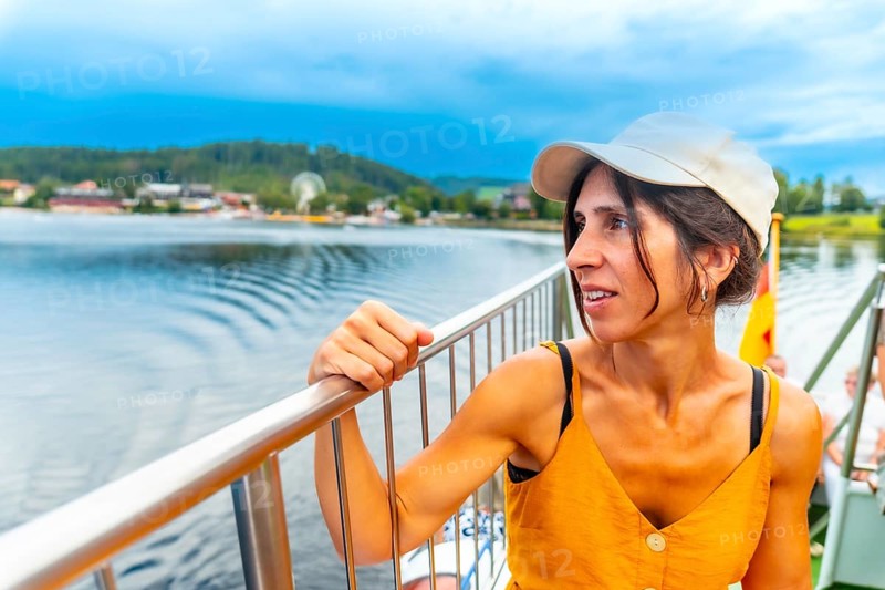 A female tourist on a boat on Lake Titisee in the Black Forest, Germany, Europe
