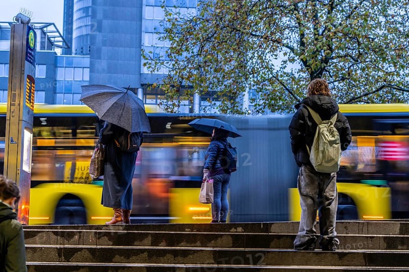 Autumn, rainy weather, bus stop at the central station, passengers waiting for the bus, Essen, North Rhine-Westphalia, Germany, Europe