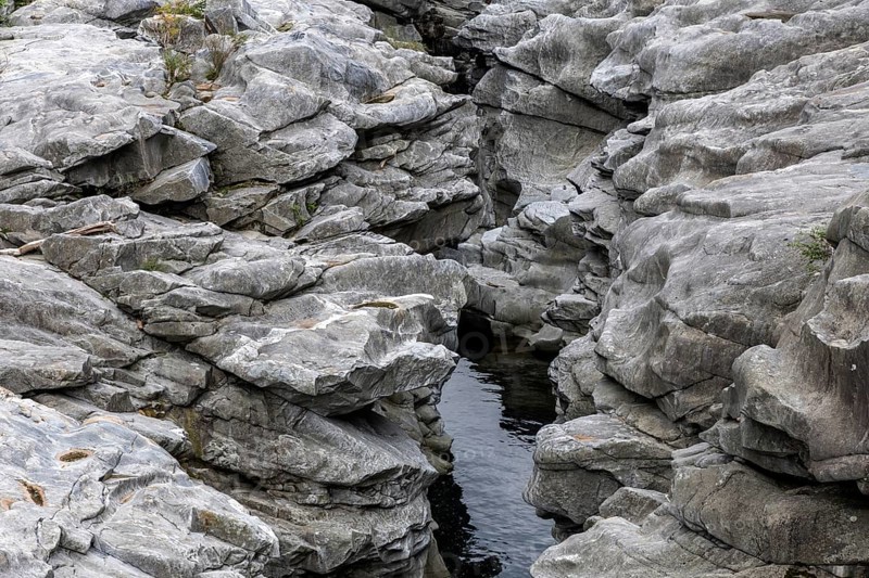 Rocks, granite rock formations in the Maggia River near Ponte Brolla, in the Maggia Valley, Valle Maggia, Canton Ticino, Switzerland, Europe
