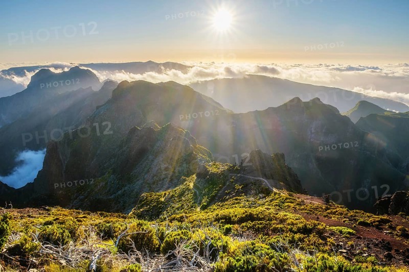 View of mountains over clouds from Pico Ruivo on sunset. Madeira island, Portugal, Europe