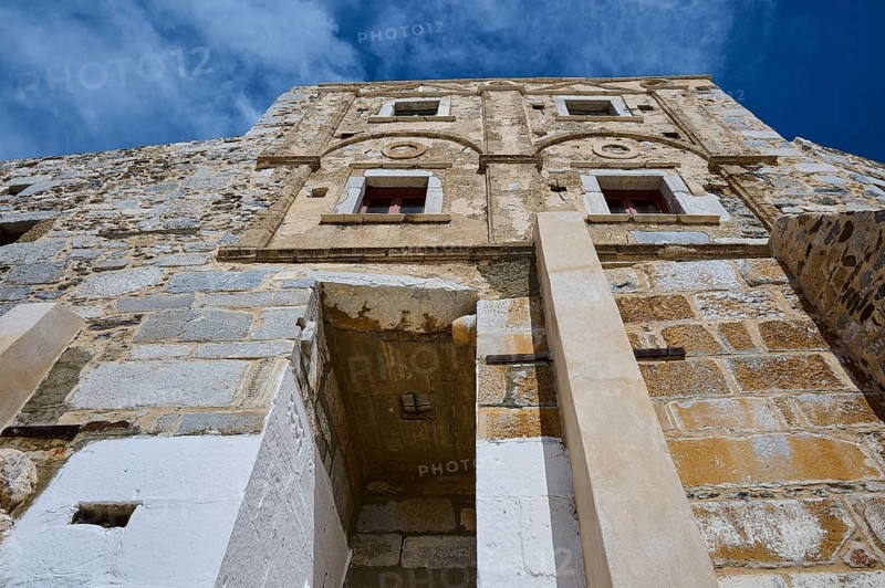Old historic wall with windows and decorated stone in the sunlight, Querini Castle, Chora, Astypalea, Dodecanese, Greek Islands, Greece, Europe