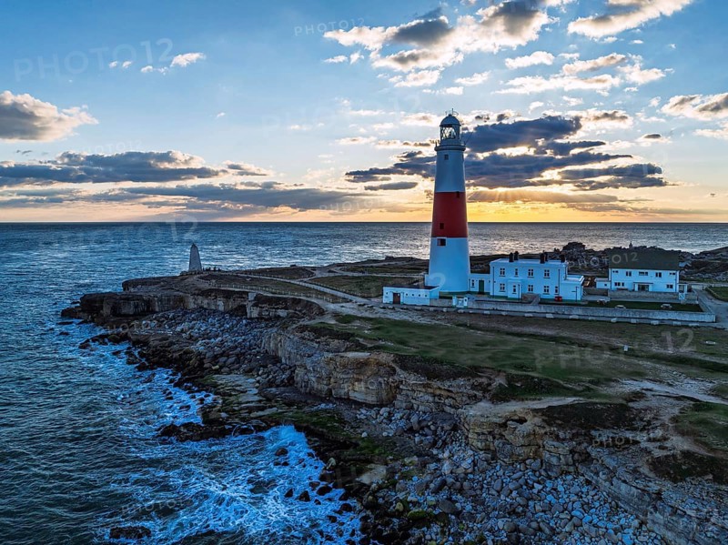 Sunset over Portland Bill Lighthouse from a drone, Portland Bill, Isle of Portland, Dorset, England, United Kingdom, Europe