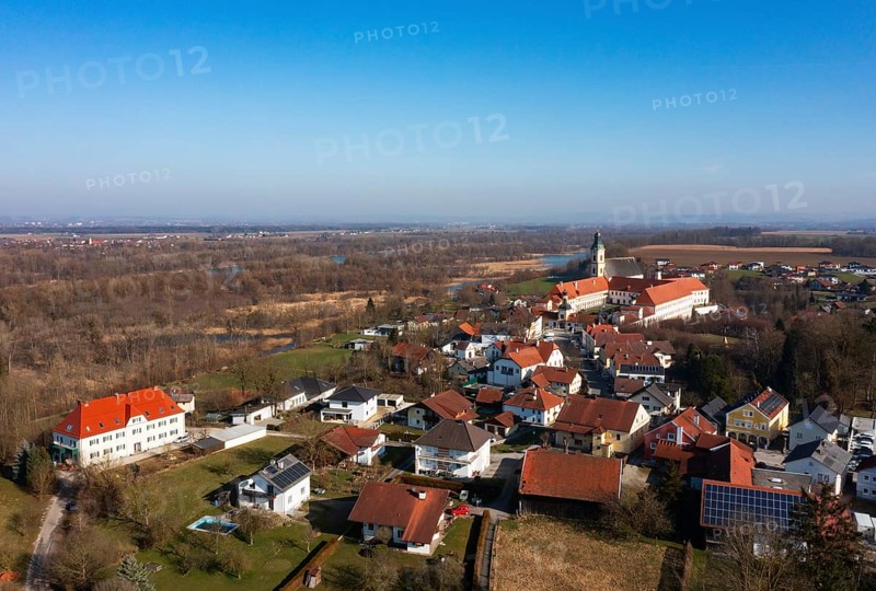 Drone shot, view of the village with Augustinian monastery Reichersberg, Reichersberg, Innviertel. Upper Austria, Austria, Europe