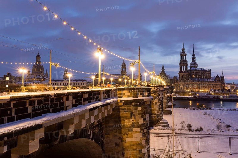 Old town across the Elbe in snow with fairy lights on the Augustus Bridge, Frauenkirche, Ständehaus, and Hofkirche, Dresden, Saxony, Germany, Europe
