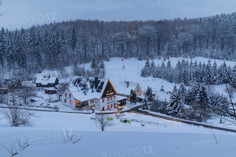 Pension Oberlochmühle with Christmas lights in the snow, Oberlochmühle, Deutschneudorf, Erzgebirge, Saxony, Germany, Europe