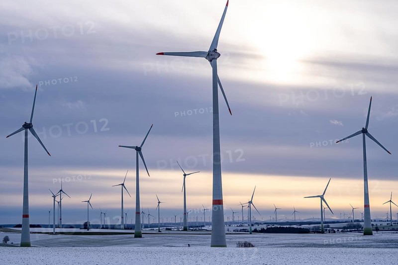 Wind farm, north of Lichtenau, self-proclaimed energy town, over 190 wind turbines and over 1200 solar panels generate 10 times as much electricity as the community of 11, 900 inhabitants consumes, largest onshore cluster of wind turbines in Germany, winter, slightly snow-covered landscape, North Rhine-Westphalia, Germany, Europe