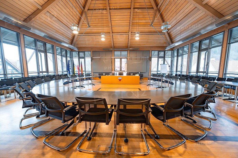 Inviting conference room with round wooden table and stylish furnishings for formal meetings, Nagold Town Hall, Black Forest, Germany, Europe