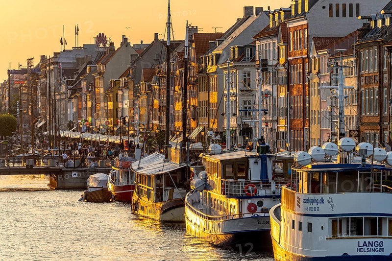 Colourful houses, restaurants and historic ships on the Nyhavn canal and harbour, Copenhagen, Denmark, Europe