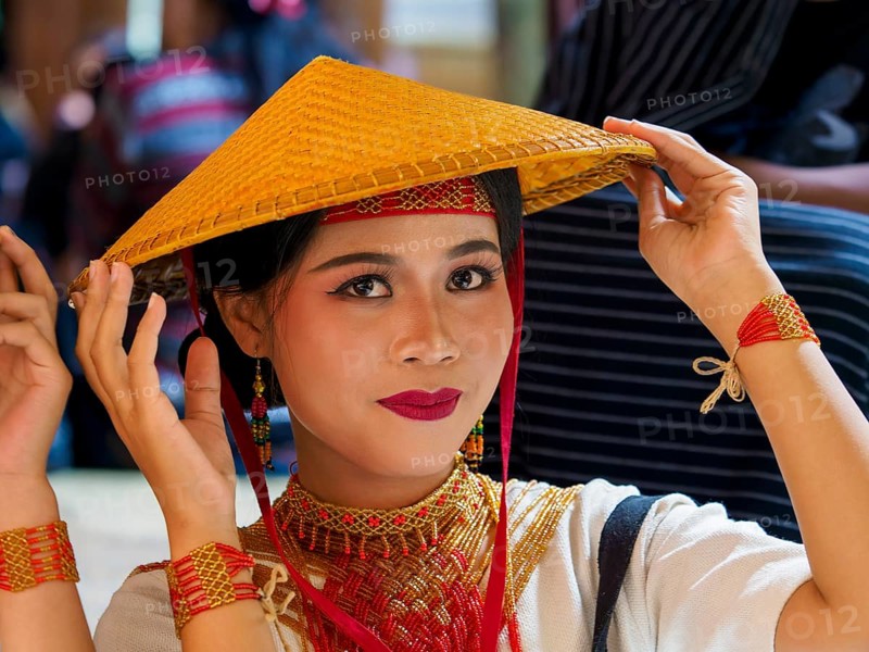 Toraja woman in traditional colourful clothing with rice straw hat, portrait, Tana Toraja, Rantepao, Sulawesi, Indonesia, Asia