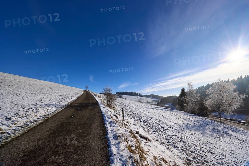 Hilly winter landscape, snow, road, deep blue sky with cirrostratus clouds, Titisee-Neustadt, Black Forest, Breisgau-Hochschwarzwald district, Baden-Württemberg, Germany, Europe