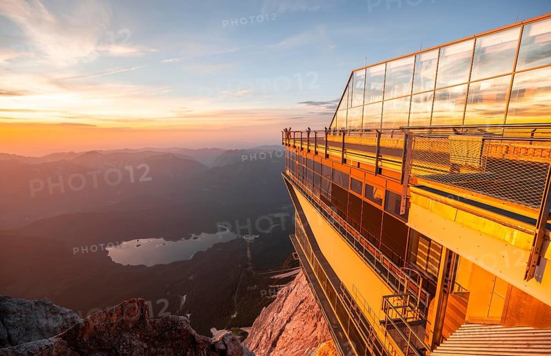 Modern mountain station of the Bavarian Zugspitze railway at the summit of the Zugspitze, view of Eibsee lake, at sunset, Wetterstein Mountains, Northern Limestone Alps, Bavaria, Germany, Europe