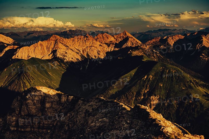 Thaneller summit at sunset in the Lechtal valley in Tyrol with a wonderful view of the surrounding mountains. Tyrol, Austria, Europe