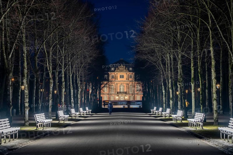 The light benches by artist Stefan Sous in the Hofgarten, entitled UV-A UV-B, 14 completely refurbished exhibits from the 2002 light-grey art exhibition, which now stand and light up as a permanent work of art on Jägerhofallee, LED technology, in the background Jägerhof Palace, home of the Goethe Museum, Düsseldorf, North Rhine-Westphalia, Germany, Europe