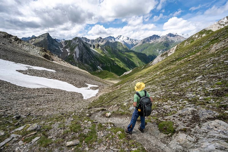 Mountaineer on a hiking trail enjoying the mountain panorama, mountain peak of the Venediger group with summit Rötspitz, Lasörling Höhenweg, Hohe Tauern National Park, East Tyrol, Tyrol, Austria, Europe
