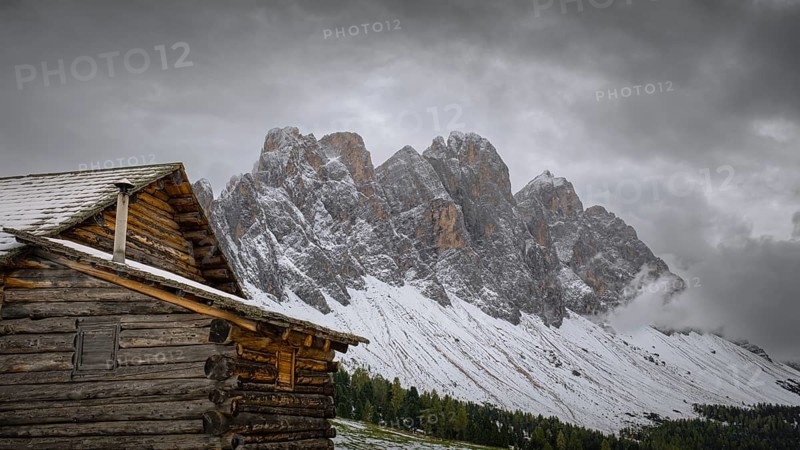 View of a part of the Geisler group from the Gampenwiese, in the foreground an alpine hut, Dolomites, snow, Puez-Geisler nature park Park, St. Magdalena, Funes, Villnößtal, South Tyrol, Italy, Europe