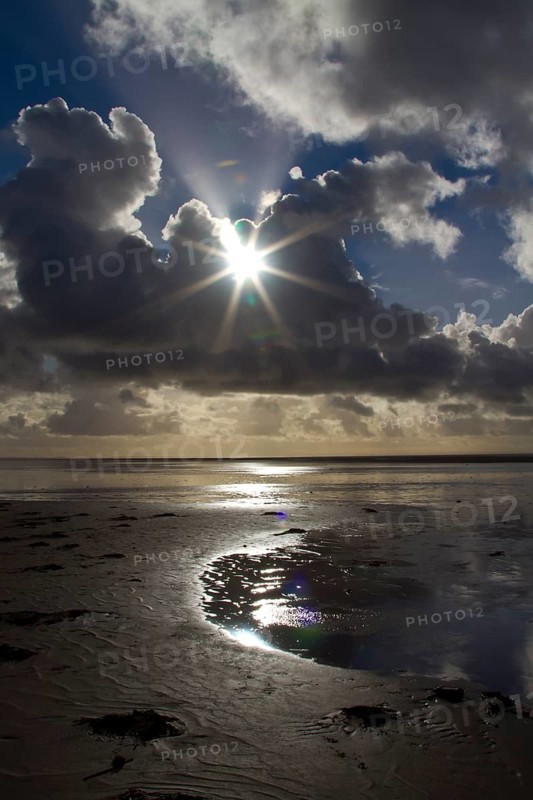 Sunburst through the clouds over the beach, South Shore, Blackpool, England, United Kingdom, Europe