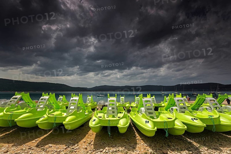 Pedal boats on the beach in Sainte Croix du Verdon, Lac de Sainte-Croix, thunderstorm atmosphere, Provence-Alpes-Côte d'Azur, Provence, France, Europe