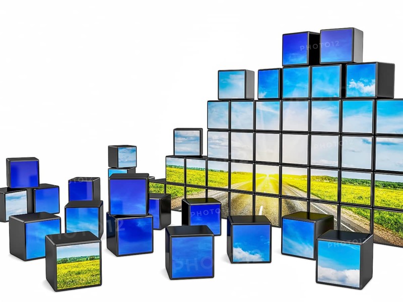 Travel concept background, cubes with beautiful landscape road in blooming spring meadow on sunset on white