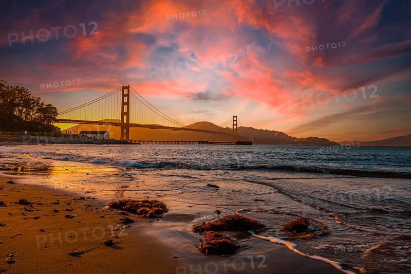 Gorgeous orange sunset with pink clouds over the Golden Gate in San Francisco, California. United States