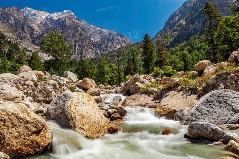 Mountain stream with waterfall cascades in Himalayas. Sangla valley, Himachal Pradesh, India, Asia