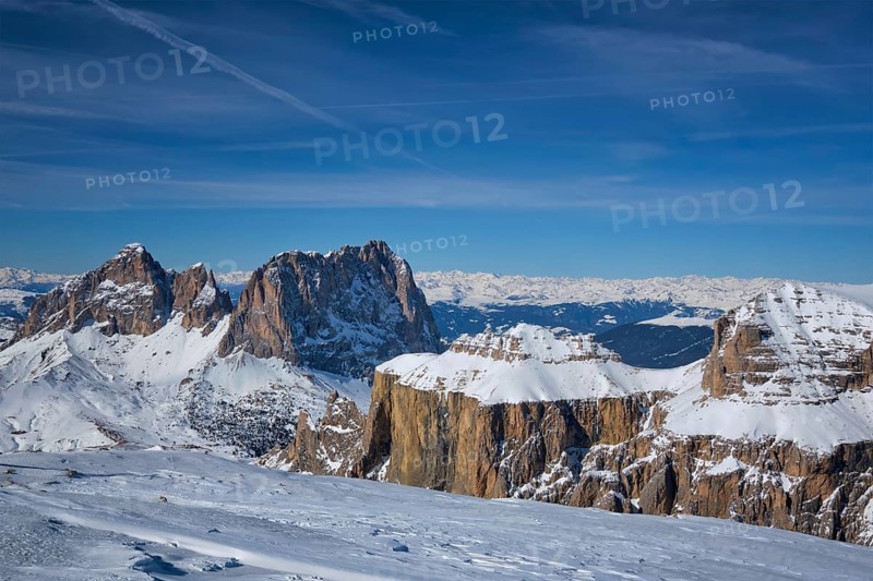 View of a ski resort piste and Dolomites mountains in Italy from Passo Pordoi pass. Arabba, Italy, Europe