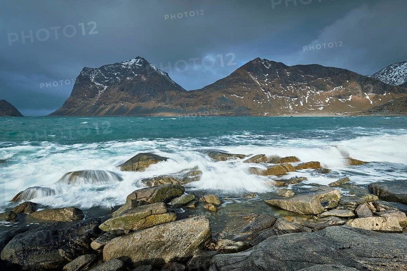 Rocky coast of fjord of Norwegian sea in winter. Lofoten islands, Norway, Europe
