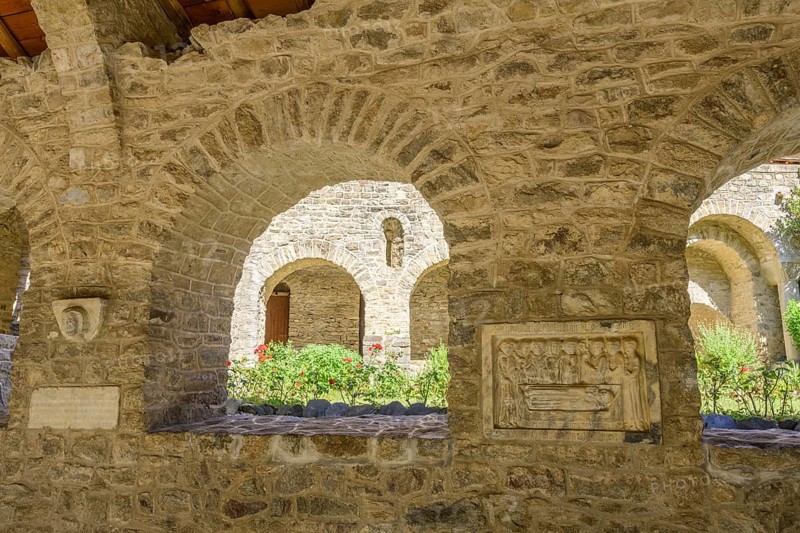 Tomb panels and inner courtyard at the cloister of Saint Martin du Canigou Abbey, Casteil, Département Pyrénées-Oriental, France, Europe