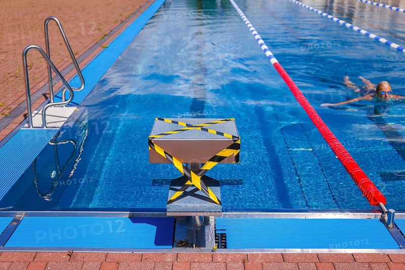 Hagen, North Rhine-Westphalia, Germany - Blocked-off starting block at the edge of the swimming pool in the Hengstey outdoor pool