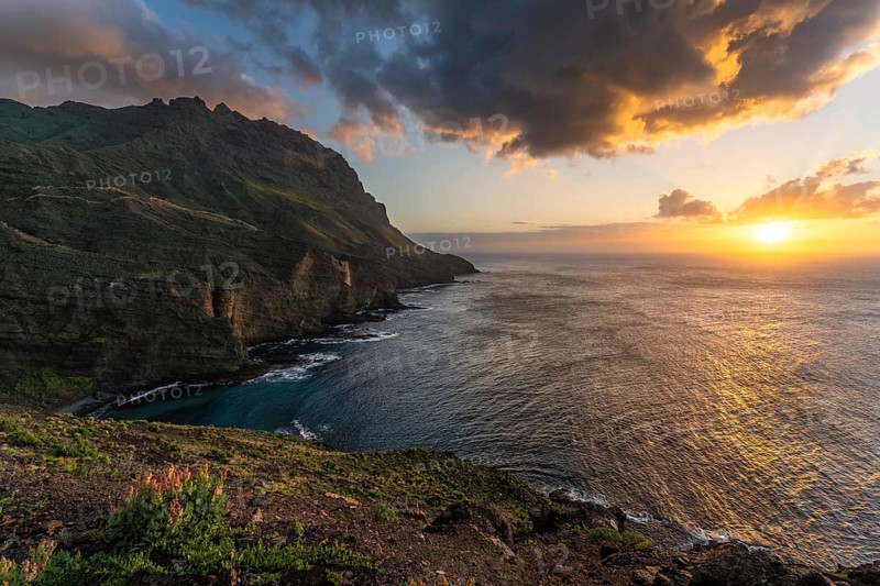 Landscape near Alojera with sea, coast, cliffs and mountains at sunset. Alojera, La Gomera, Canary Islands, Spain, Europe