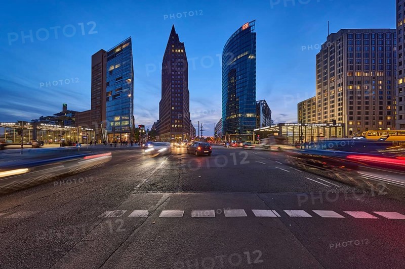 Vehicles with motion blur and light traces, skyscrapers Forum Tower, Kollhoff Tower and railway tower in the blue hour at Potsdamer Platz, dusk in Berlin, capital, independent city, federal state Berlin, Germany, Europe