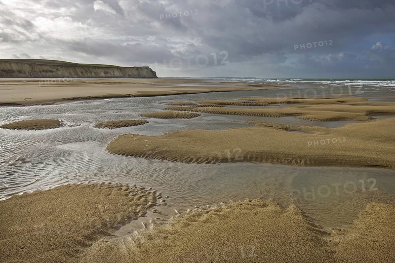 Tide pools on sand beach at low tide at Cap Blanc Nez, Pas-de-Calais, France, Europe