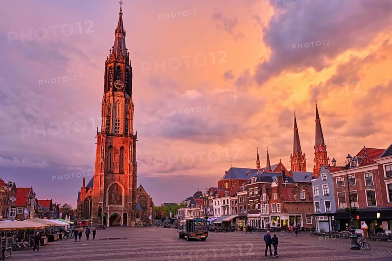 Nieuwe Kerk New Church protestant church on Delft Market Square Markt with dramatic sky on sunset. Delft, Netherlands