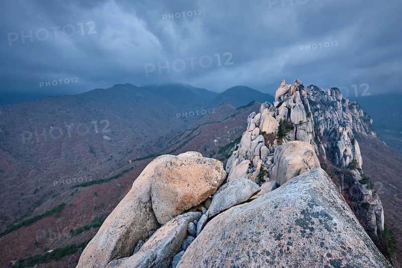 View of stones and rock formations from Ulsanbawi rock peak in stormy weather with clouds. Seoraksan National Park, South Corea