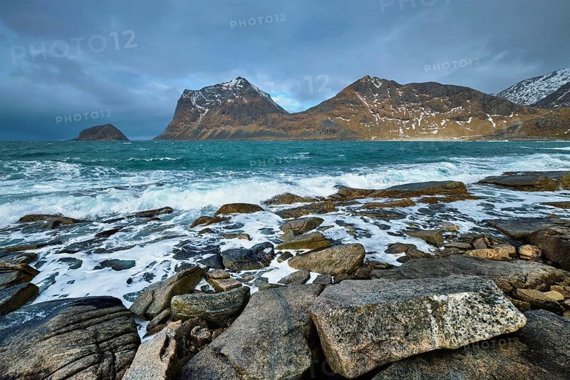 Rocky coast of fjord of Norwegian sea in winter. Lofoten islands, Norway, Europe