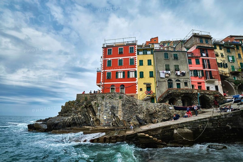 RIOMAGGIORE, ITALY, APRIL 25, 2019: Riomaggiore village popular tourist destination in Cinque Terre National Park a UNESCO World Heritage Site, Liguria, Italy in stormy weather