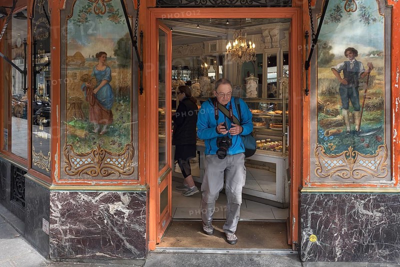 Elderly gentleman comes from a traditional bakery, built around 1900, Paris, France, Europe