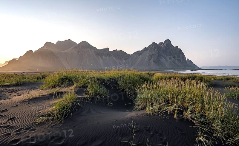 Black beach with volcanic sand, sandy beach, dunes with grass, Stokksnes headland, Klifatindur mountain range, Austurland, East Iceland, Iceland, Europe