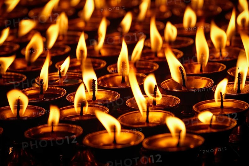 Burning candles in Buddhist temple. Dharamsala, Himachal Pradesh, India, Asia