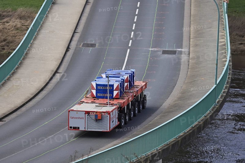 Heavy-duty bridge test Load test on the closed Elbe bridge in Bad Schandau. The load-bearing capacity of the bridge is to be tested using autonomously moving heavy-duty modules with continuously increasing loads of up to 80 tonnes. More than 50 microphones were attached to the structure for this purpose, which are intended to make prestressing steel fractures inside the structure audible by measuring sound emissions. If no prestressing steel fractures can then be detected, the bridge could be partially opened to traffic from May. Cars and light lorries up to 3.5 tonnes as well as special trips for buses could then pass. However, monitoring of the bridge continues, Bad Schandau, Saxony, Germany, Europe