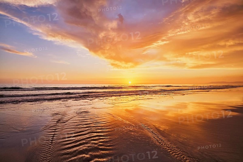 Atlantic ocean sunset with surging waves at Fonte da Telha beach, Costa da Caparica, Portugal, Europe
