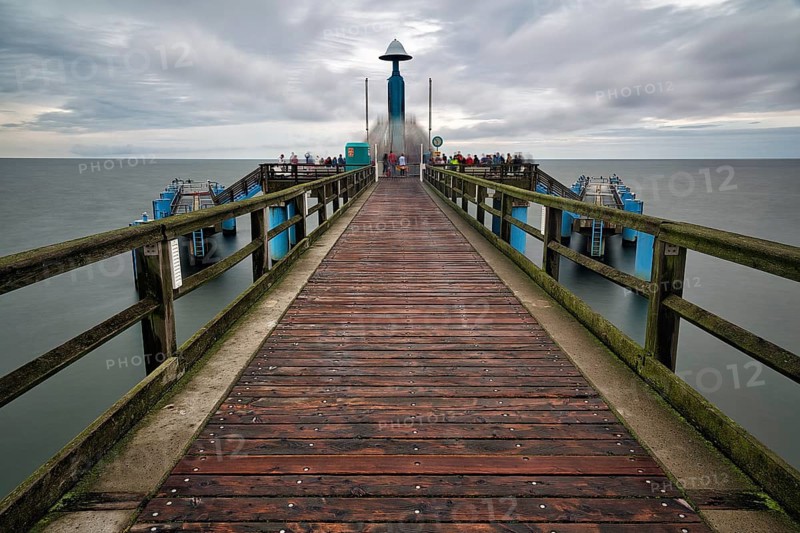 Sellin pier with tourists in front of diving gondola, rainy weather on the Baltic Sea, long exposure, Baltic resort Sellin, Rügen Island, Mecklenburg-Western Pomerania, Germany, Europe