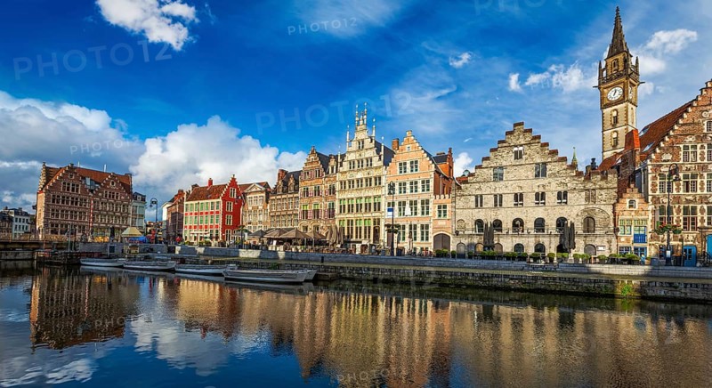 Europe Belgium medieval town travel background, panorama of Ghent canal and Graslei street on sunset. Ghent, Belgium, Europe