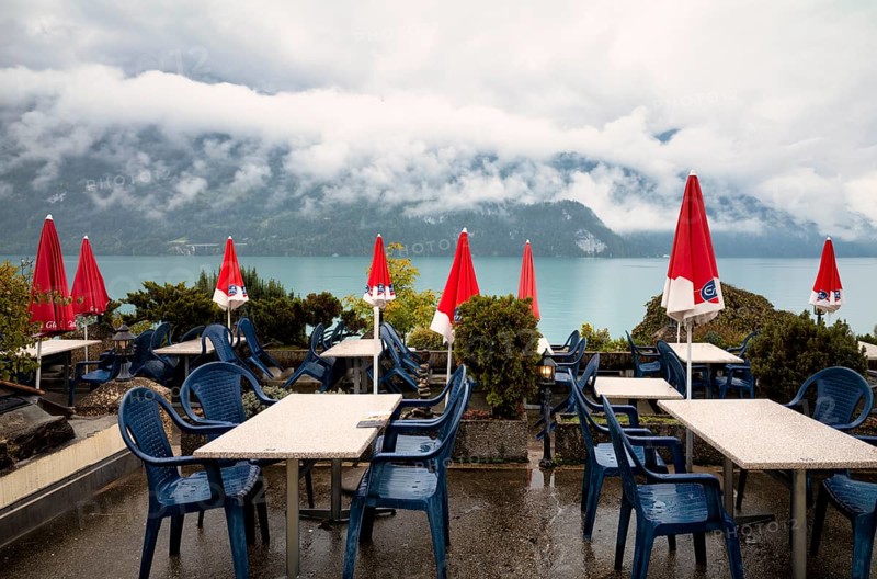 Empty restaurant, café, bad weather on the lake promenade at Lake Brienz, Brienz, Canton Bern, Bernese Oberland, Switzerland, Europe