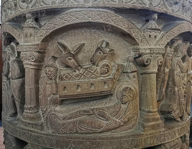 Romanesque baptismal font from 1129 in the former collegiate church of St. Boniface, relief depicting the birth of Jesus, Freckenhorst, Warendorf district, Baden-Württemberg, Germany, Europe