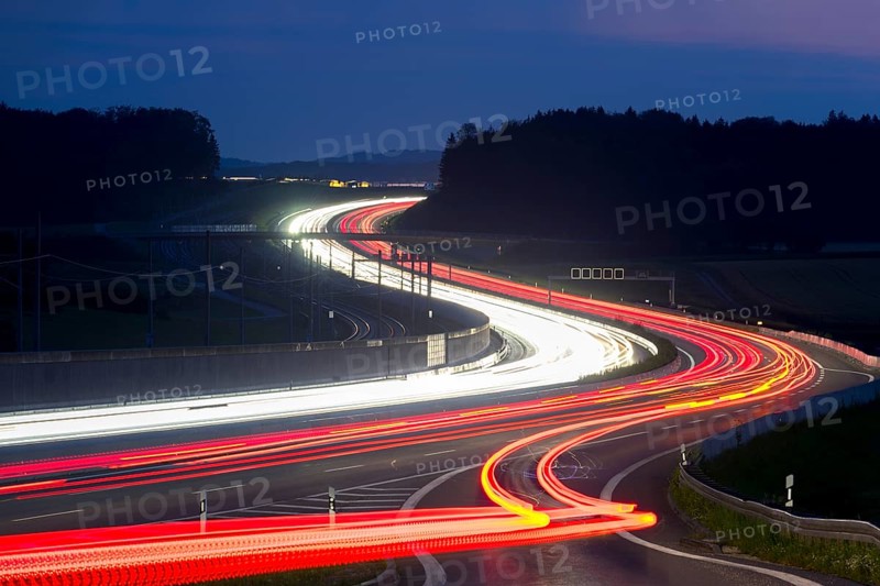 Tracers on the A8 motorway, winding road, evening, long exposure, Swabian Alb, Baden-Württemberg, Germany, Europe