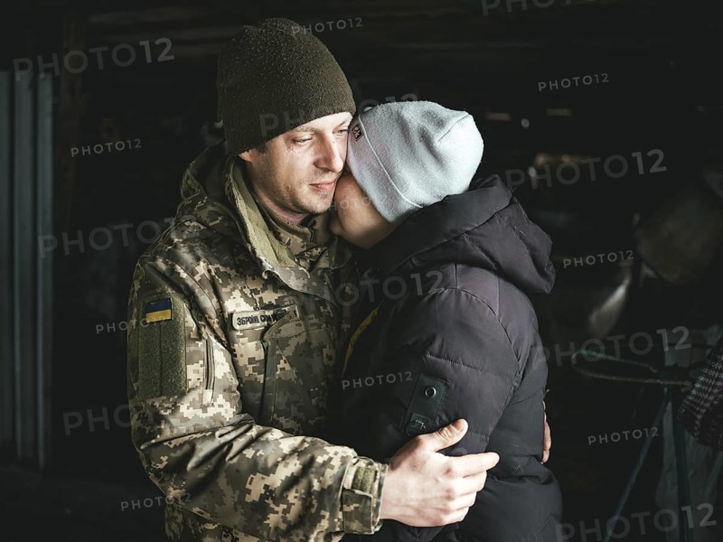 A Ukrainian soldier says goodbye to his woman after a furlough, Hroza, Ukraine, Europe