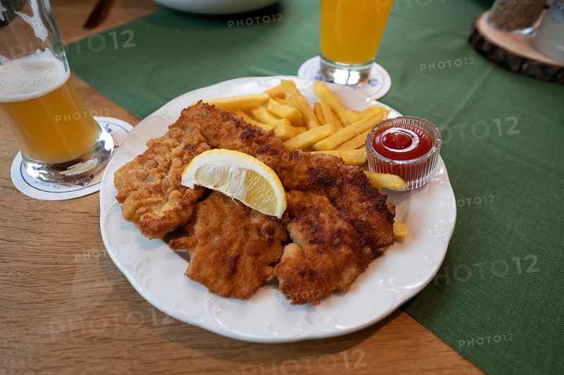 Wiener Schnitzel with French fries served in a pub, Bavaria, Germany, Europe