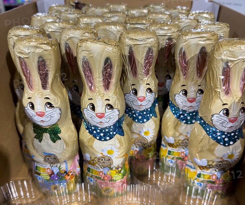 Display on retail shelf wholesale of chocolate Easter bunnies Easter bunnies made of chocolate wrapped in gold coloured staniol paper, Germany, Europe