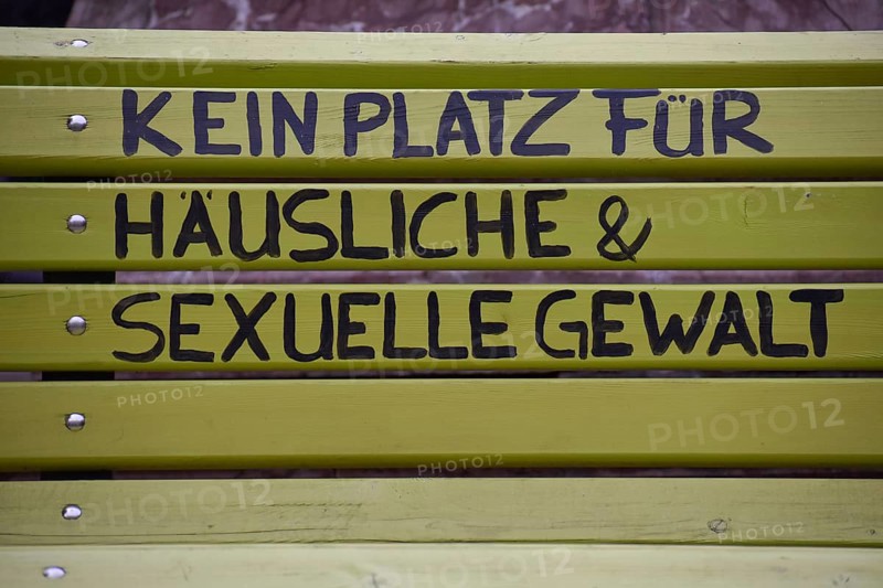 Green bench with the inscription No place for domestic and sexual violence, seen in Burghausen, Bavaria, Germany, Europe