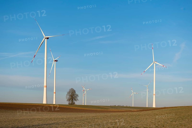 Several wind turbines rotating over a wide field, sustainable energy generation shown, solar park, near Ulm, Swabian Alb, Baden-Württemberg, Germany, Europe